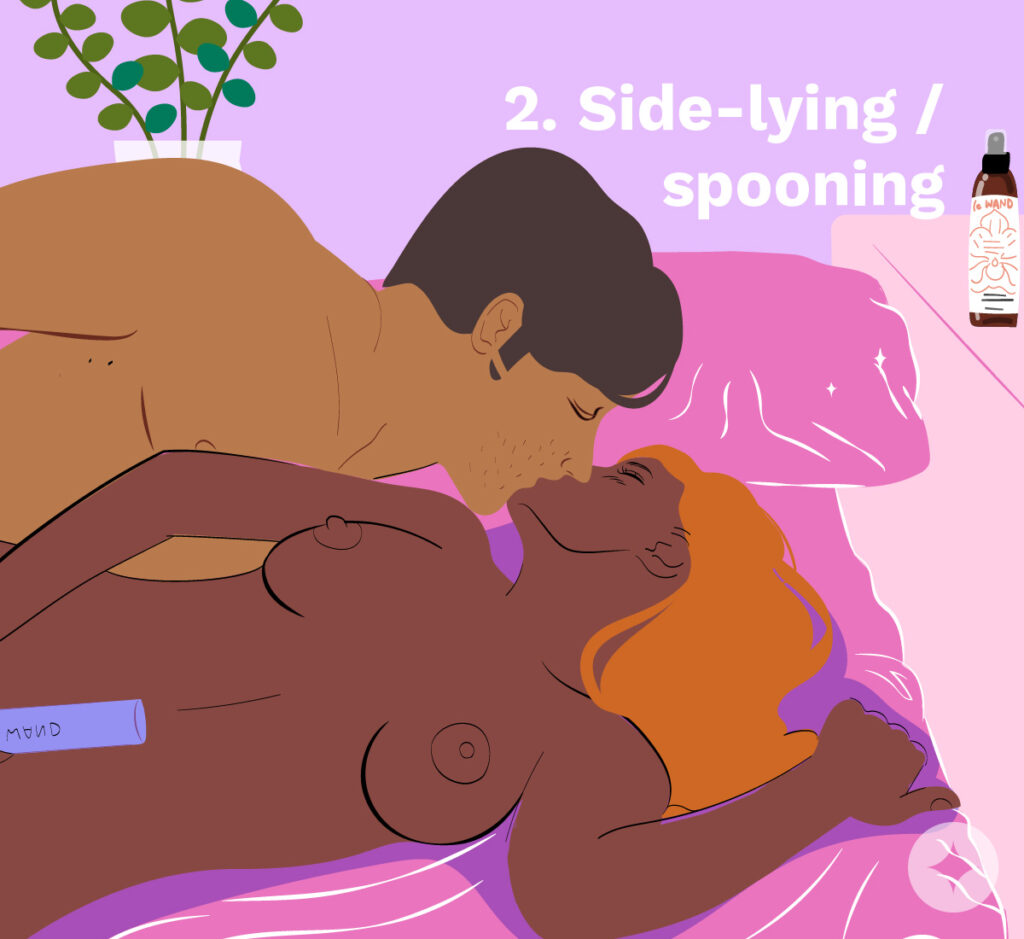Using a wand massager sex toy with a partner while spooning